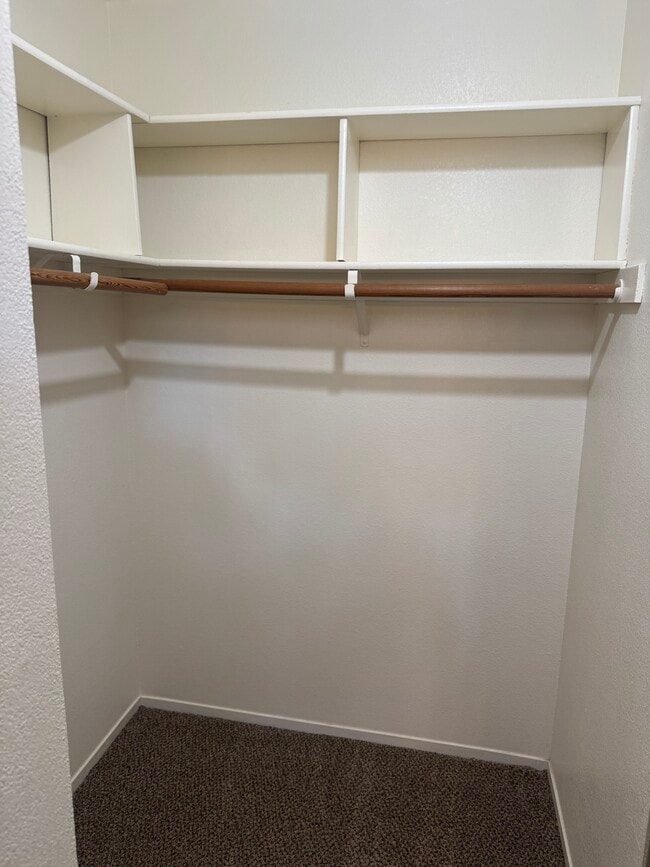 Walk-in closet in primary bedroom - 102 Marina Dr N