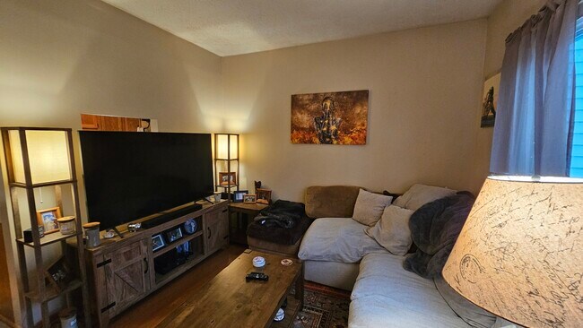 Living Room - other side (had passthrough opening to kitchen which is covered by TV in this photo.) - 4549 Lincoln Ave