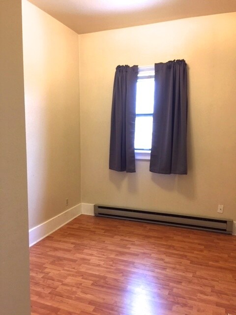 Bedroom 2/office, north facing window, closet with significant storage space above. - 425 E Broadway St