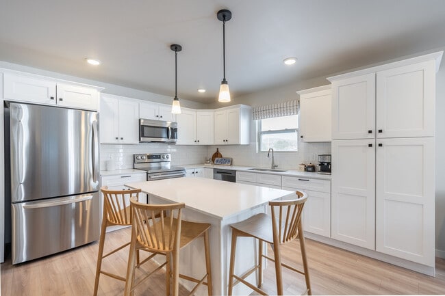 A stylish apartment kitchen ready for weekday dinners, weekend brunches, and late-night snacks. - Liv East Bay