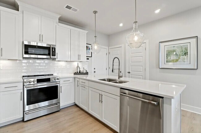 Kitchen, Garage Entrance, Pantry, and Powder Room - 4413 Greybull Dr