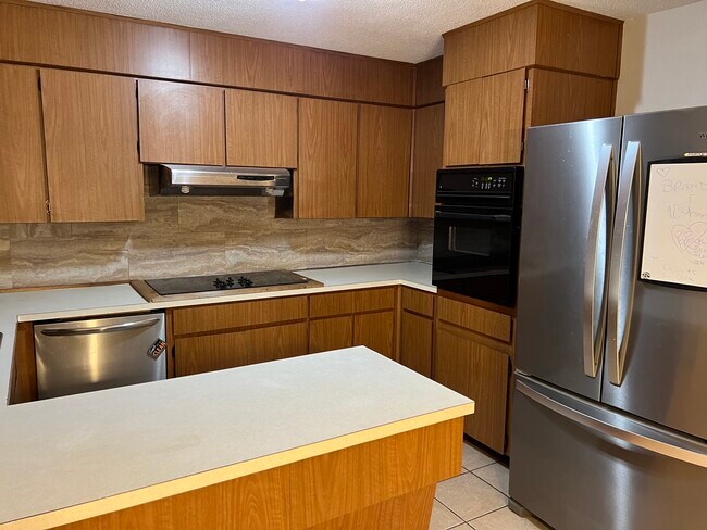 Kitchen with stainless appliances - 3965 Bailey Rd