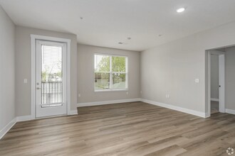 Living area with a patio/balcony of an apartment home at Tiffany Flats. - Tiffany Flats