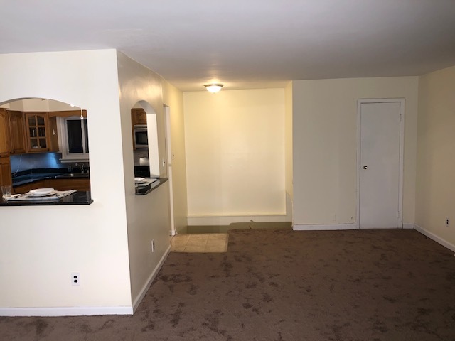 Entrance from tot of stairs to kitchen and living room - 24547 149th Ave