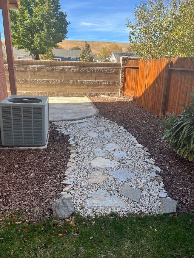 Building Photo - Located in the Gated Community of Casitas ...