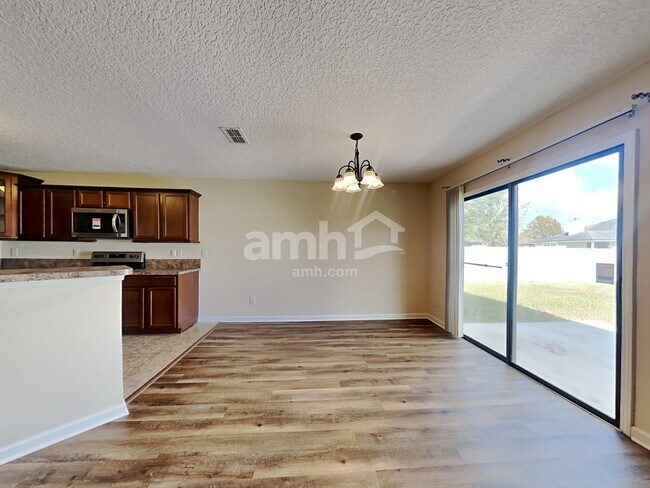 Building Photo - 7344 Rapid River Dr E