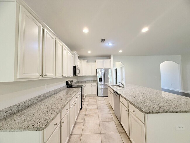 Building Photo - Spacious 5-Bedroom Home - Heart of Pace