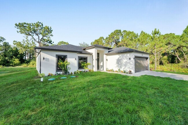 Foto del edificio - Brand-New Home in Lehigh Acres – Move-In Ready! FL 33974. Qualify for a deposit-free option and s...