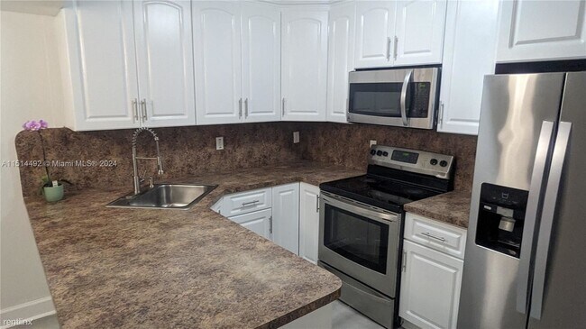 Building Photo - 3 br, 2 bath House - 6460 W 27th Ct # 13-53