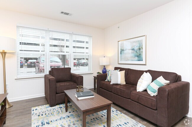 2BR, 2BA - 931 SF - Living Room - Trifecta Apartments