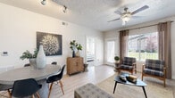 Located at 751 W 200 S in American Fork, Utah, this thoughtfully designed two-bedroom, two-bathroom residence offers a comfortable and efficient single-floor layout. Light wood-look flooring flows throughout the main living areas, complementing the neutral color palette that lends a clean, modern feel to the space.

The kitchen is a standout feature, boasting rich dark wood cabinetry with brushed nickel hardware, white countertops, and stainless steel appliances including a range, microwave, and refrigerator — providing ample storage and prep space.

The open living room is bright and welcoming, with large windows that invite natural light and offer views of the surrounding neighborhood. Ceiling fans are present in the main living area and bedrooms for added comfort.

The generously sized primary bedroom features multiple windows, plush carpet, and access to a walk-in closet with built-in shelving and hanging rods. The second bedroom is equally well-lit, with large windows and soft carpeting. Both bathrooms include tub/shower combinations, wood-look flooring, and dark wood vanities with white countertops.

A dedicated in-unit laundry area accommodates a full-size washer and dryer with overhead shelving, adding everyday convenience to this well-rounded residence.