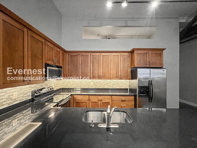 Photo - 2 Bed/2 Bath Condo with Modern Amenities / Pet-Friendly / Available Now!