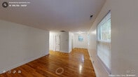 Located at 803 Demerius St in Durham, NC, this well-maintained one-bedroom, one-bathroom home offers a practical and comfortable single-floor layout. Warm, richly toned hardwood floors run throughout the entire space, lending a classic character that ties each room together cohesively.

The living room is generously proportioned relative to the overall footprint, featuring large windows fitted with blinds that allow ample natural light to fill the space while offering views of the surrounding greenery. Clean white walls and neutral finishes create a bright, inviting atmosphere throughout.

The bedroom is a comfortable, well-lit room with two windows that frame outdoor tree views, providing a peaceful and airy feel. A closet offers dedicated storage to keep the space organized.

The kitchen is efficiently designed with white shaker-style cabinetry, granite-look countertops, a stainless steel sink, and a white electric range. A window above the counter brings in natural light, making the space feel open despite its compact size.

The bathroom is clean and functional, featuring a full soaking tub with a shower, built-in shelving, and a window for ventilation and natural light. A hallway connects the rooms, ensuring a logical and easy-to-navigate flow throughout this tidy, move-in-ready home.
