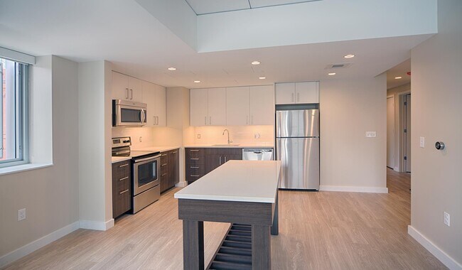 Brand-new kitchens feature two-tone modern cabinets, quartz countertops and an island - Vivo