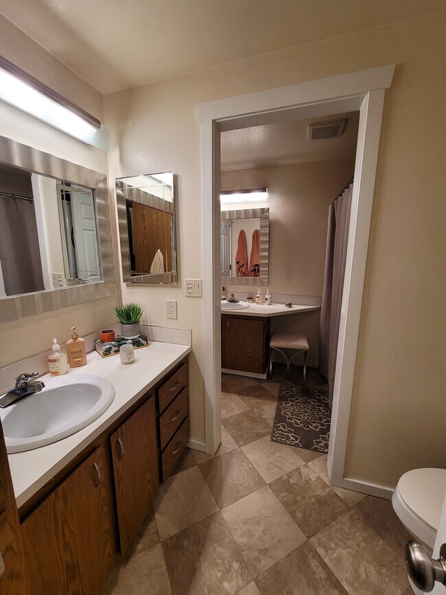 Full bathroom with two vanities, shower, tub, toilet, and laundry - 15707 4th Ave S