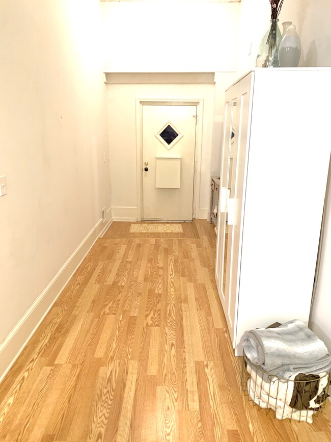 Hallway inside the apartment - opens to a spacious living room - 1137 W 41st St