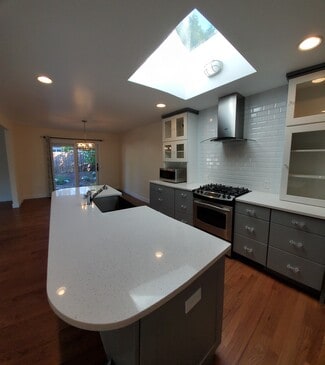 Kitchen with skylight and marble tops - 8120 Kitamat Way