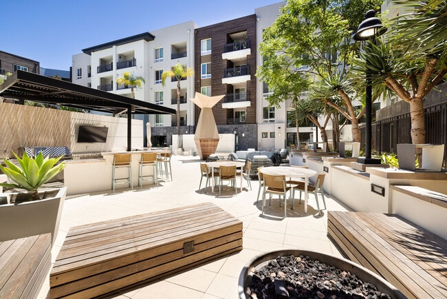 Outdoor Seating Area and Pool Deck | Elan Huntington Beach | Apartments in Huntington Beach, CA - Elan Huntington Beach