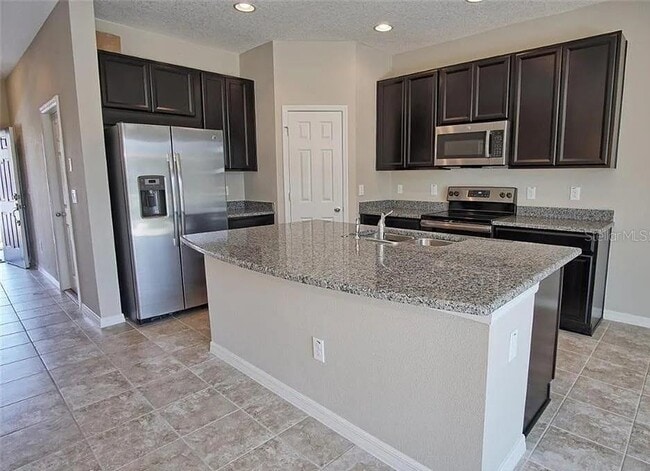 Foto del edificio - 7026 Woodchase Glen Dr