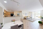 Located at 4764 W Atlantic Blvd in Coconut Creek, FL, this 2-bedroom, 2-bathroom residence offers a well-designed single-floor layout with a bright, open feel throughout. Light wood-look tile flooring runs continuously through the main living areas, enhancing the sense of space and cohesion.

The open-concept living and dining area is anchored by large sliding glass doors that flood the room with natural light and open directly onto a private patio with outdoor views. The kitchen features light maple cabinetry, a peninsula breakfast bar, black appliances including a range, refrigerator, and dishwasher, track lighting, and ample counter and storage space.

The spacious primary bedroom benefits from natural light and generous closet space. The second bedroom comfortably accommodates multiple beds and features a bright window with outdoor views. Both bathrooms are clean and functional, with one featuring a full tub-shower combination and a vanity with storage.

Additional highlights include an in-unit laundry area, six closets throughout for abundant storage, and a hallway connecting the private spaces. The overall ambiance is light, airy, and well-suited for comfortable Florida living.