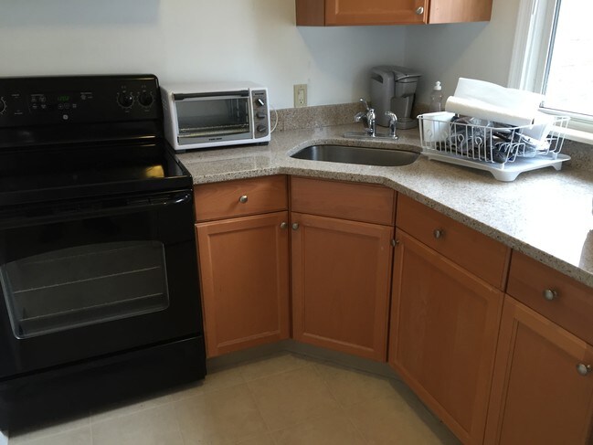 New kitchen with tile floor and granite count - 7 S Avolyn Ave
