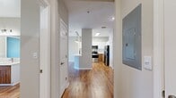 This 740 square foot, single-floor apartment offers a harmonious blend of functionality and style. The open-concept design seamlessly integrates the kitchen and living areas, creating a spacious feel. The kitchen features modern stainless steel appliances, white cabinetry, and a convenient breakfast bar, perfect for casual dining or entertaining.

The living room is bathed in natural light from large windows, some offering French door access to a private balcony. Warm wood flooring throughout the main living areas adds a touch of elegance and easy maintenance. The bedroom, generously sized at 160 square feet, includes plush carpeting and a ceiling fan for comfort.

The bathroom showcases a contemporary design with a wood vanity and ample lighting. A dedicated laundry room with full-sized washer and dryer adds convenience to daily life. The apartment also features a walk-in closet with wire shelving for optimal storage.

Additional amenities include central heating and cooling, and window blinds for privacy. The neutral color palette throughout allows for easy personalization. This well-designed apartment efficiently utilizes every square foot, providing a comfortable and modern living space in the heart of Riverview, Florida.