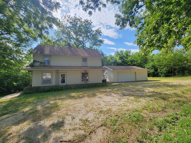 Building Photo - Nice home with oversized 2car gar with wor...