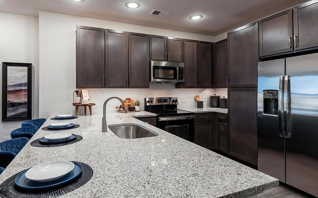 Sleek Kitchen Featuring Built-In Pantry Cabinets and Stainless Steel Finishes - The Harper