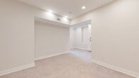 Located at 305 W Fourth St in downtown Winston-Salem, NC, this thoughtfully designed 2-bedroom, 1-bathroom unit offers a bright and clean living environment finished in a crisp, neutral palette. The open-concept kitchen is well-appointed with white shaker cabinetry, black hardware accents, a subway tile backsplash, and a full suite of stainless steel appliances including a refrigerator, range, microwave, and dishwasher. The kitchen flows seamlessly into the main living area, which features light tile flooring and recessed lighting throughout, creating a cohesive and airy feel. The primary bedroom is a comfortable, well-proportioned space with recessed lighting and easy access to the hallway. The second bedroom is equally clean and versatile. Two closets provide practical storage throughout the unit. The full bathroom is finished with light wood-look tile flooring, white cabinetry with dark hardware, and clean white wall tile, accented by brushed nickel fixtures and grab bars. Crisp white panel doors and wide baseboards are consistent throughout, adding a polished architectural detail to every room. The overall design is modern, functional, and move-in ready, making this unit an ideal space in the heart of Winston-Salem.