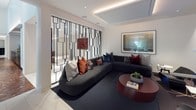 Located at 30 W Howell St in Boston's Dorchester neighborhood, this refined single-floor amenity space showcases a seamless blend of contemporary design and high-end finishes. The layout flows naturally between distinct yet connected zones, each thoughtfully curated for comfort and function.

A striking entryway sets the tone with richly patterned parquet wood flooring and clean white walls, opening into the broader space. A dramatic black geometric screen partition serves as a defining architectural feature, elegantly dividing the lounge from the corridor while adding a bold visual statement. Recessed and cove lighting throughout creates a warm, layered ambiance.

The lounge area centers around a generous wraparound sectional sofa in deep charcoal, accented with jewel-toned throw pillows and anchored by a rounded deep-red coffee table. A large-format framed artwork adorns the wall, complementing the room's curated aesthetic. The adjacent media room features a wall-mounted large-screen television, a floating media console, and an assortment of modern accent seating, ideal for screenings or casual gatherings.

The billiards room offers a spacious, light-filled environment with large-format porcelain tile flooring, a professional-grade pool table as its centerpiece, and an upholstered leather wall panel providing both style and acoustic warmth. Framed artwork and subtle cove lighting complete the refined atmosphere of this versatile amenity space.