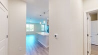Located at 2819 Dixie Ave in Savannah, Georgia, this well-appointed single-story home offers 2 bedrooms and 3 bathrooms with a clean, modern design aesthetic. Light-toned luxury vinyl plank flooring flows throughout the main living areas, complementing the bright, neutral color palette.

The open-concept kitchen and living area serves as the heart of the home, featuring light wood cabinetry, quartz countertops, a herringbone tile backsplash, stainless steel appliances, and a central island with pendant lighting overhead — ideal for both everyday living and entertaining.

The primary bedroom is a comfortable, well-sized retreat, carpeted for warmth, with natural light streaming through large windows fitted with plantation-style blinds. It is accompanied by a spacious en-suite bathroom showcasing a walk-in glass shower with marble-style tile surround, a wood-toned vanity with quartz countertop, and light vinyl flooring. A walk-in closet with wire shelving provides generous storage. The second bedroom is similarly bright and carpeted, with a ceiling fan and outdoor views. A second full bathroom features a tub-shower combo with matching marble-style tile. All three bathrooms maintain a cohesive, modern finish throughout the home.