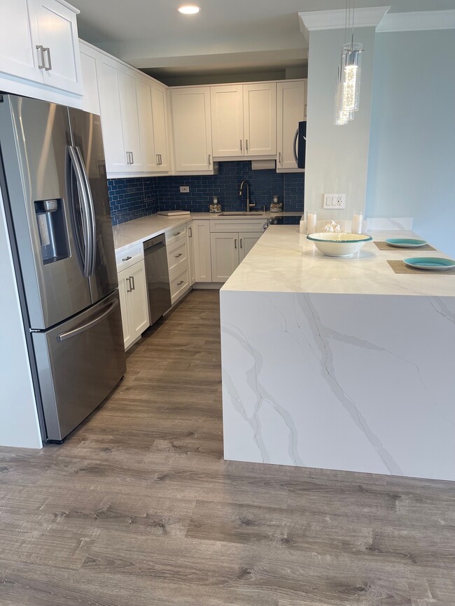 Newly Renovated Kitchen with Waterfall Countertop - 2800 N Flagler Dr