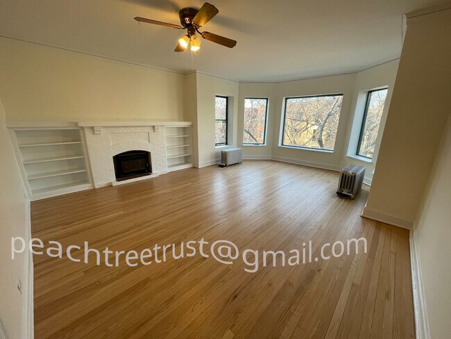 large and sunny front room in an oversize, top floor apartment. - 1351 W Carmen Ave