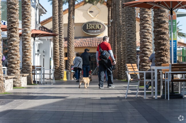 It's common for residents of Enterprise to walk their pets in Town Square.