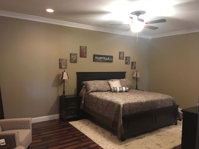 Private bedroom with ceiling fan. - 1023 Kidron Way