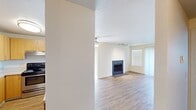 This contemporary apartment on Monroe Avenue in Renton, WA offers 740 square feet of well-designed living space. The single-story layout includes two bedrooms, two full bathrooms, and an open-concept living area. The primary bedroom is generously sized at 150 square feet, providing ample space for relaxation.

Throughout the apartment, wood-style flooring adds warmth and durability. The living room is a focal point, featuring a modern fireplace and sliding glass doors that lead to a private outdoor area, allowing natural light to flood the space. Track lighting and a ceiling fan enhance the ambiance and comfort.

The updated kitchen boasts light wood cabinetry, stainless steel appliances, and a convenient breakfast bar. Both bathrooms are well-appointed, with one featuring a combination tub/shower and wooden vanity.

Storage is plentiful with built-in closets in the bedrooms and additional closet space throughout. The neutral color palette and clean lines create a fresh, contemporary feel, making this apartment an ideal canvas for personal style. The combination of functionality and modern aesthetics makes this space perfect for comfortable, efficient living.