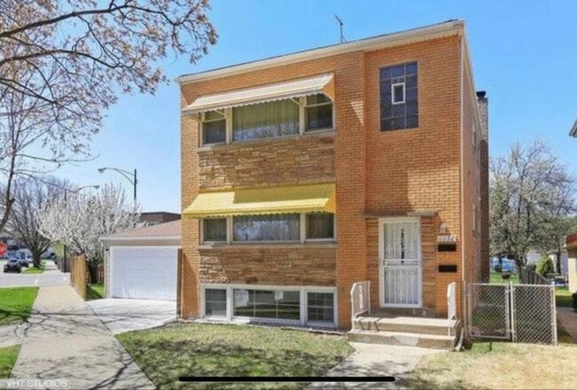 Building Photo - 6052 W Miami Ave
