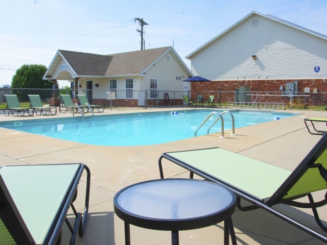 Pool w/ chairs - Parkwood Apartments