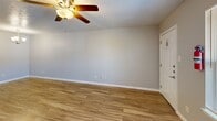 Located along Lyndon B. Johnson Freeway in Dallas, TX, this 1-bedroom, 1-bathroom unit offers a thoughtfully designed single-floor layout that maximizes every square foot. Wood-look flooring flows consistently throughout the space, lending warmth and visual continuity from room to room. Ceiling fans are present in the main living area and bedroom, providing both comfort and light.

The open-concept living, dining, and kitchen area serves as the heart of the unit. The living space features a bright window and a front entry door, creating a welcoming atmosphere with natural light. The galley-style kitchen is outfitted with gray shaker cabinets, granite-look countertops, stainless steel appliances — including a refrigerator and electric range — and a built-in sink, offering a modern and functional cooking environment.

The bedroom is a well-proportioned private retreat with a ceiling fan, a window with neighborhood views, and access to two closets. The bathroom is cleanly finished with large-format tile surrounding the tub-shower combination, a granite-topped vanity, and matching gray cabinetry that mirrors the kitchen's design aesthetic. A hallway connects the living spaces to the bedroom and bath, keeping the layout efficient and organized.