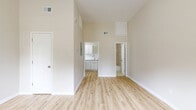 Located at 7 S Reed Ave in Mobile, Alabama, this efficiently designed one-bedroom, one-bathroom unit offers a thoughtful layout across a single floor. The main living area immediately impresses with notably high ceilings that create a strong sense of openness and volume well beyond what the footprint might suggest. Light wood-look plank flooring runs throughout, complementing the warm, neutral beige walls and bright white trim for a clean, contemporary aesthetic. Natural light filters in through multiple windows, including a front-facing door with glass panels in the spacious bedroom, further enhancing the airy atmosphere. The kitchen is well-appointed with white shaker-style cabinetry, granite-look countertops, a white subway tile backsplash, stainless steel refrigerator, and an electric range with over-the-range ventilation — plus a window that brings in additional natural light. A dedicated pantry provides convenient extra storage. The bathroom features a full tub-shower combination with elegant, large-format marble-look wall tile in warm beige tones and chrome fixtures. A closet adds functional storage to the bedroom. The unit also includes a dedicated HVAC system with wall-mounted thermostat, ensuring year-round comfort throughout this well-maintained, move-in ready space.