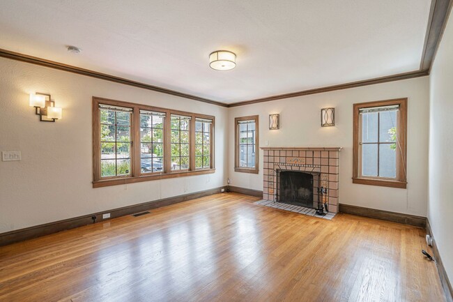 Main living space, original fireplace - 1360 Hopkins St