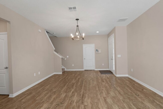 Building Photo - Spacious, Nearly New and Gated 3/2.5/2 Plu...