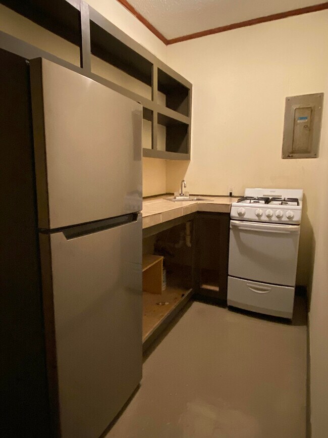Kitchenette with gas stove and new fridge. - 1109 North Yale Street