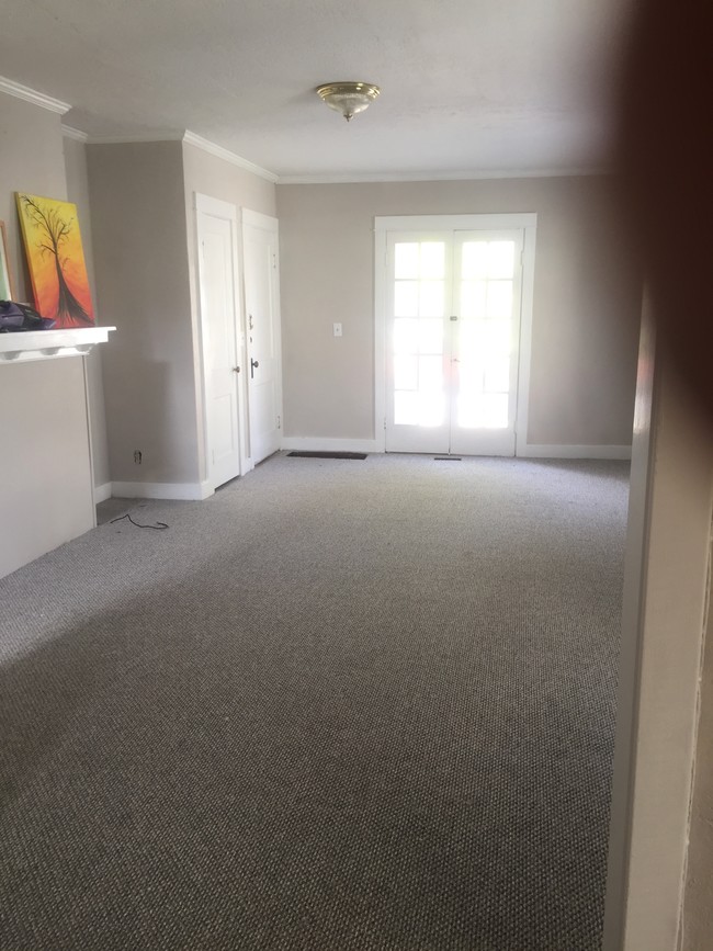 Living room with mantel and French Doors - 575 E Church St