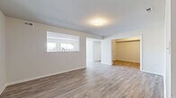 Located on Nava Ct in Carlisle, PA, this single-floor, 3-bedroom, 2-bathroom home offers a clean, modern design with thoughtful finishes throughout. The open-concept living area features warm wood-look luxury vinyl plank flooring, neutral-toned walls, and a pass-through window that visually connects the living space to the kitchen, enhancing the sense of openness and flow.

The kitchen is well-equipped with white shaker cabinetry, granite-style countertops, a stainless steel appliance suite including a refrigerator, range, microwave, and dishwasher, and wood-look flooring that continues from the main living area. Natural light streams in through large windows, adding brightness to the space.

The three bedrooms offer comfortable proportions, with the primary bedroom providing a generous footprint. The bedrooms feature plush carpeting, neutral walls, and ample natural light. One bedroom includes a built-in closet with double doors for added storage convenience.

The bathrooms are finished with white cabinetry, wood-look flooring, and a full tub-shower combination with clean, bright fixtures. A dedicated closet provides additional storage.

Throughout the home, consistent neutral tones, modern flooring, and clean architectural lines create a cohesive and inviting atmosphere suited for comfortable everyday living.