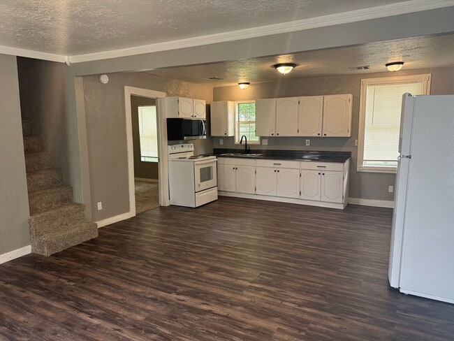 Photo - Cutest 2-bedroom cottage with a loft! Huge shady backyard for all things outdoor! All Brand new a...