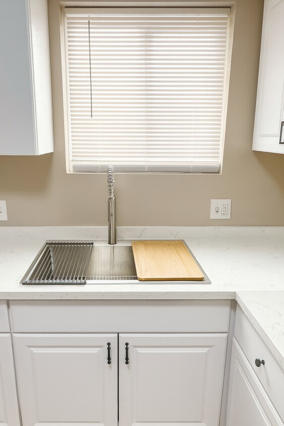 New modern stainless steel sink with quartz countertop. - 2132 W 104th St