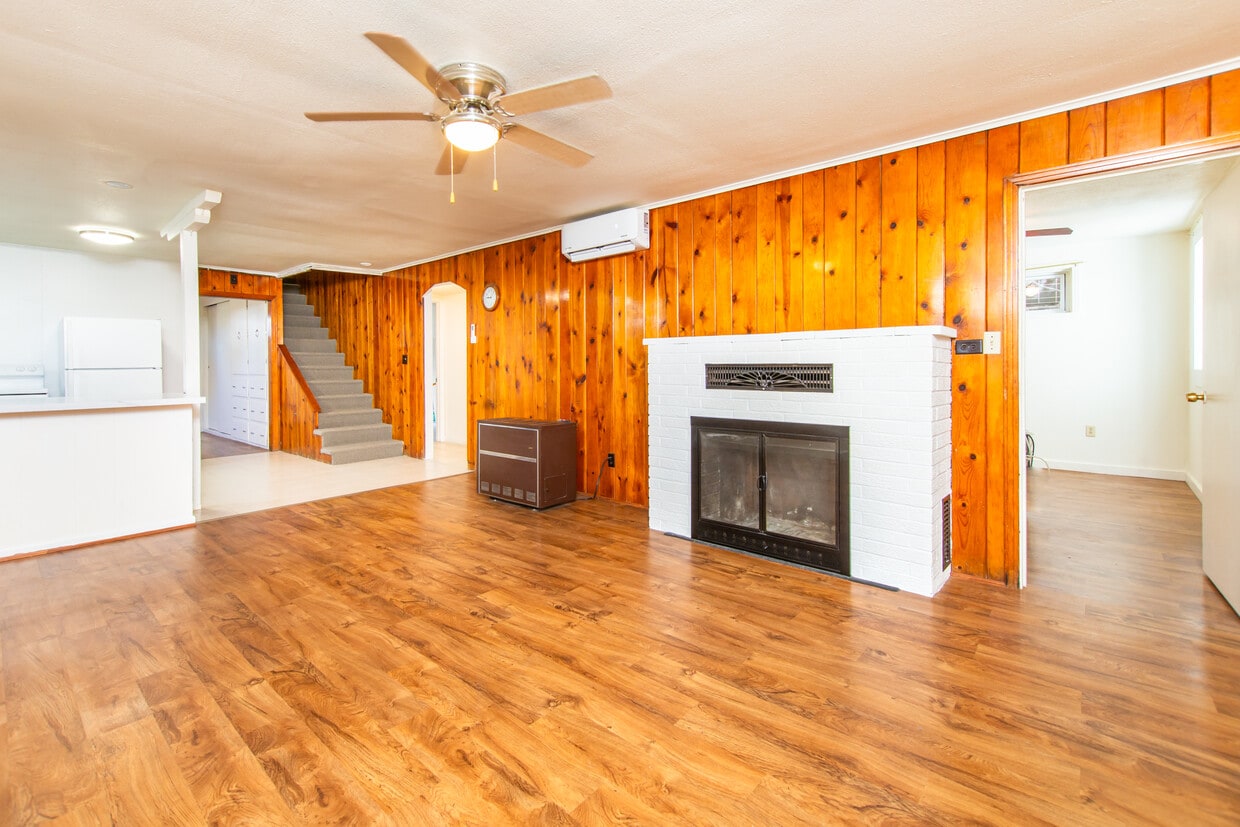 Living room looking at entrance stairs - 318 Saint Onge St