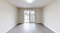 Located at 1020 Paisley Rd in Guelph, Ontario, this well-designed one-bedroom, one-bathroom unit offers a thoughtful layout with modern finishes throughout. The open-concept kitchen and living area serves as the heart of the home, featuring a peninsula breakfast bar with pendant lighting overhead, white cabinetry, and stainless steel appliances including a refrigerator, stove, and over-the-range microwave. Light hardwood-style flooring runs seamlessly through the main living spaces, complementing the neutral, warm-toned walls.

The living area is bright and spacious, with sliding glass doors that lead directly to a private balcony, offering outdoor views of the surrounding neighbourhood. The bedroom is generously sized, featuring a large window that brings in ample natural light and a mirrored sliding-door closet that adds both function and a sense of space. The hallway connecting the rooms is finished with light tile flooring and ceiling ventilation, reflecting a clean and functional design.

The bathroom is fitted with a full soaker tub and shower surround in a crisp white finish. Throughout the unit, clean lines, consistent finishes, and a neutral colour palette create a bright, cohesive, and contemporary living environment.