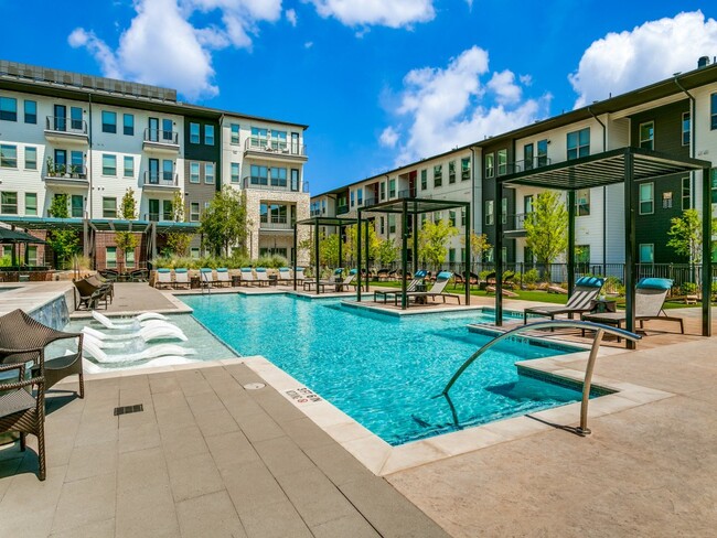 Resort-style pool with expansive sundeck and Baha shelf - Sagemont